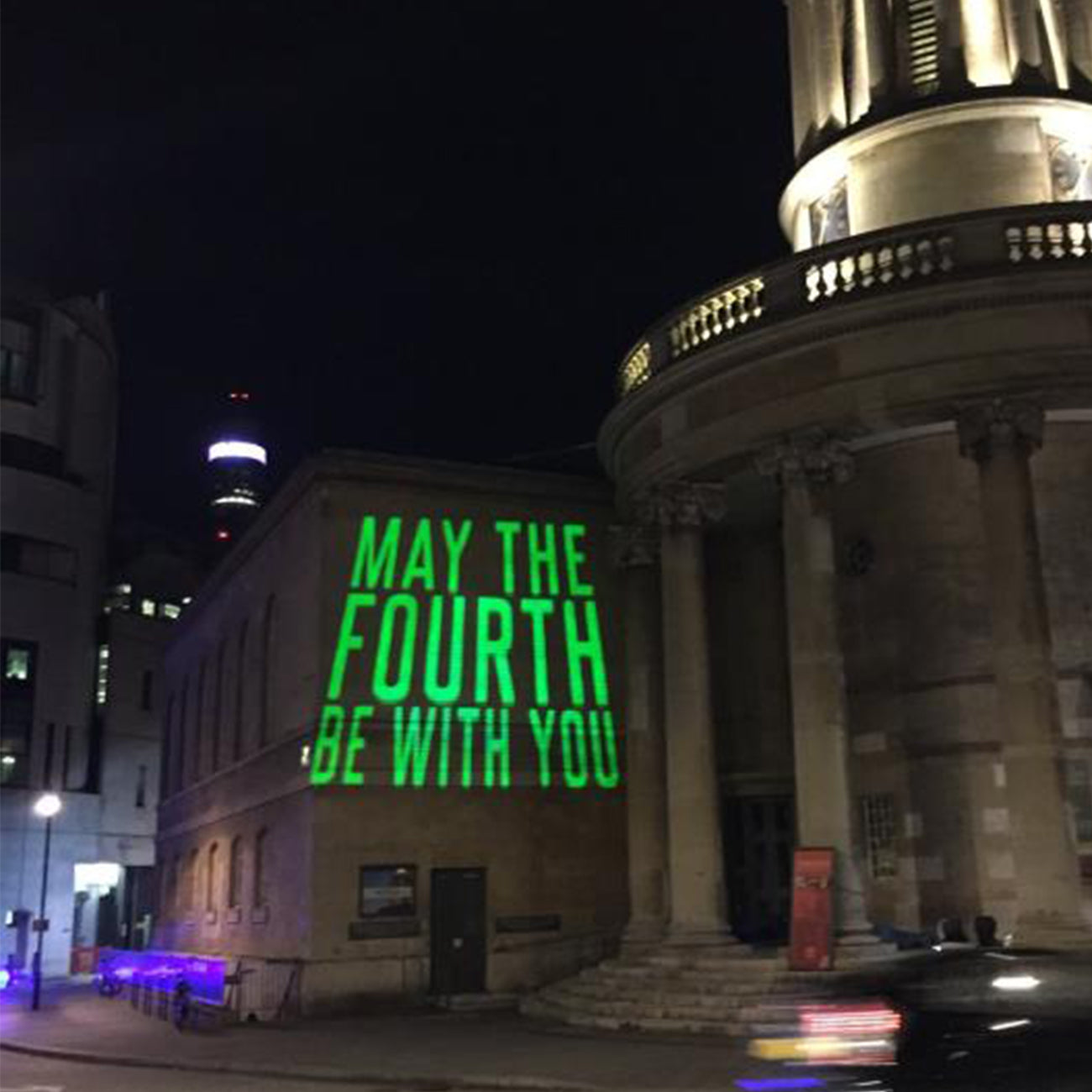 Powerful 100W projector light projecting a pattern at an outdoor event