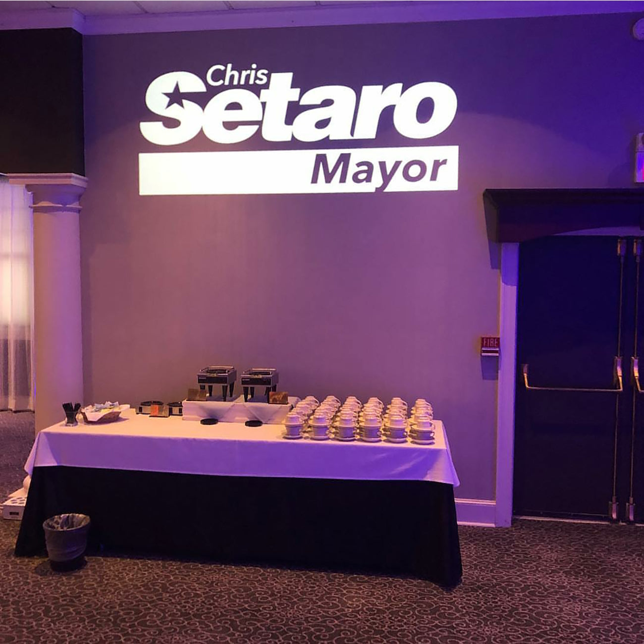 15W projector light mounted on a base for small event or signage use