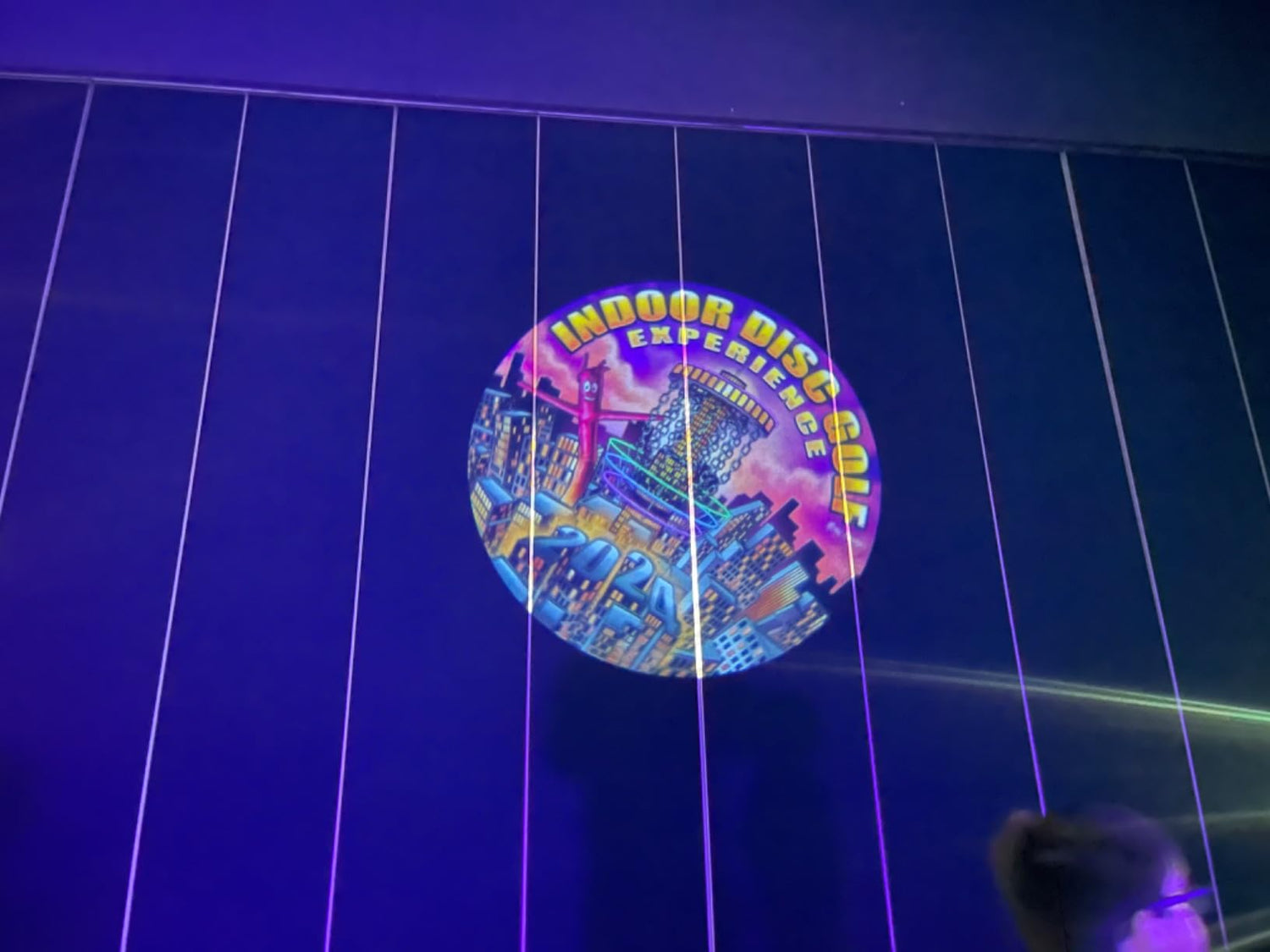 Event projector light displaying a custom logo at a corporate event